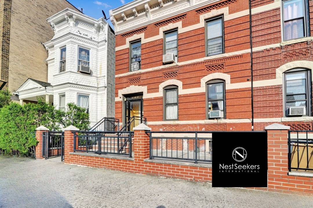 Love the vibe of this three-family townhome perfectly positioned on the LIC/Astoria border.
