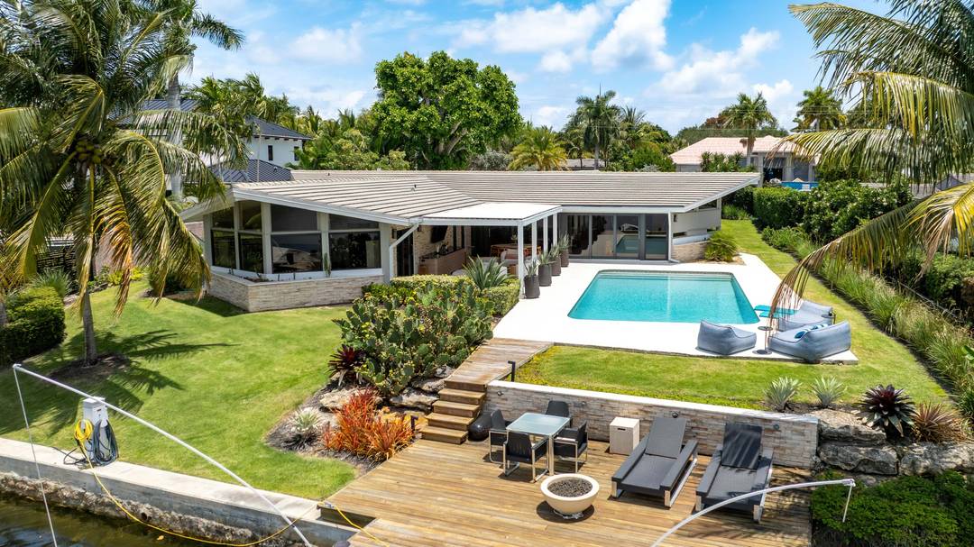 Situated on the Middle River, in the charming neighborhood of Coral Ridge, this home is a one of a kind, mid century modern masterpiece.