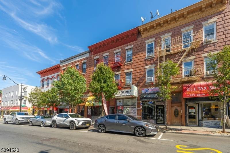 Excellent Investment Opportunity Mixed Use Building with 8 Units and 6 Residential and Two Commercial Storefronts Discover an exceptional investment opportunity with this mixed use building, generating an annual gross ...