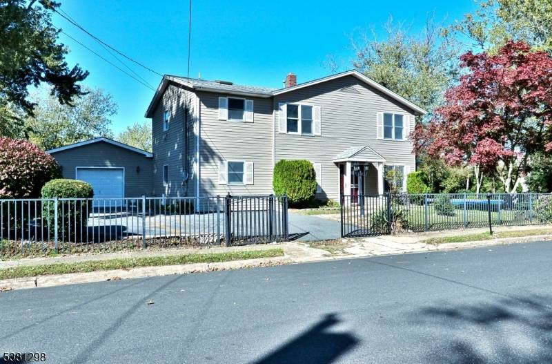 Spacious home in Neptune, NJ, offering incredible potential on an oversized corner lot !