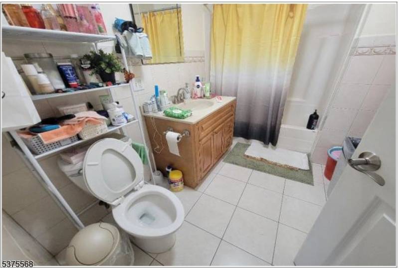 Condo unit features hardwood floors throughout.